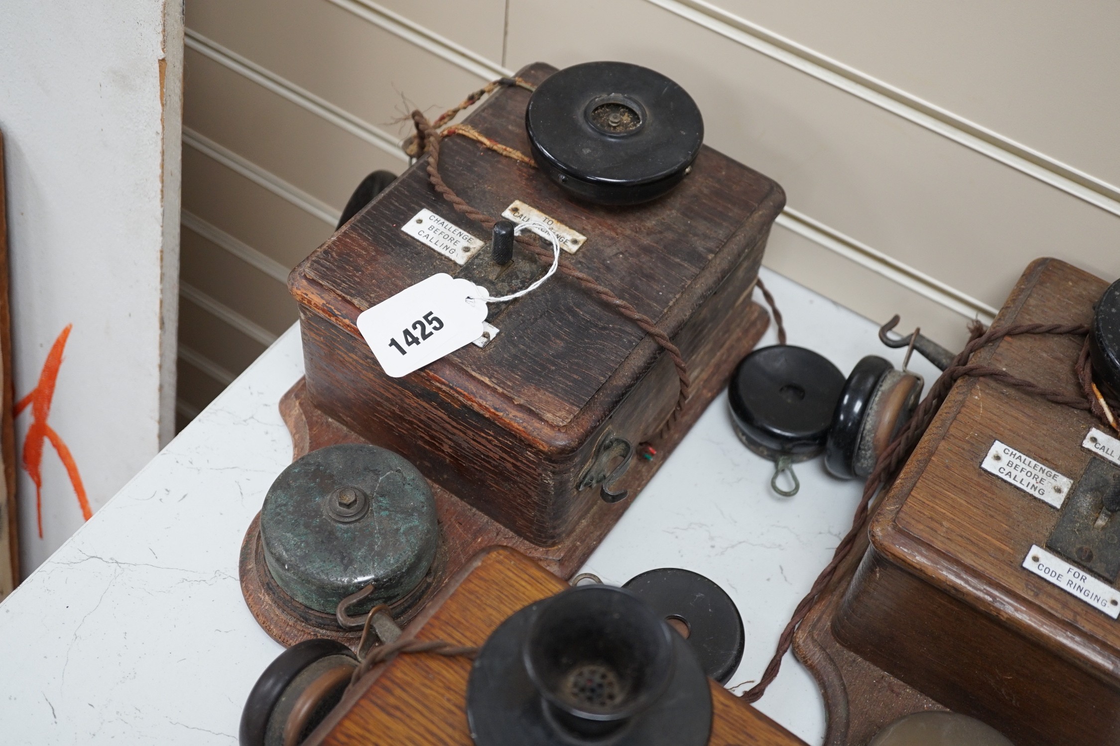 Three Ericsson oak cased railway signal box telephones, largest 30cms long